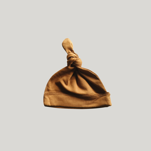 Knotted Hat. Brass